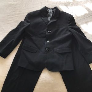 Boys Black Calvin Klein suit.
